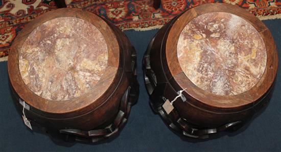 A pair of late 19th century Chinese marble inset rosewood barrel shaped stands or stools, H.53cm